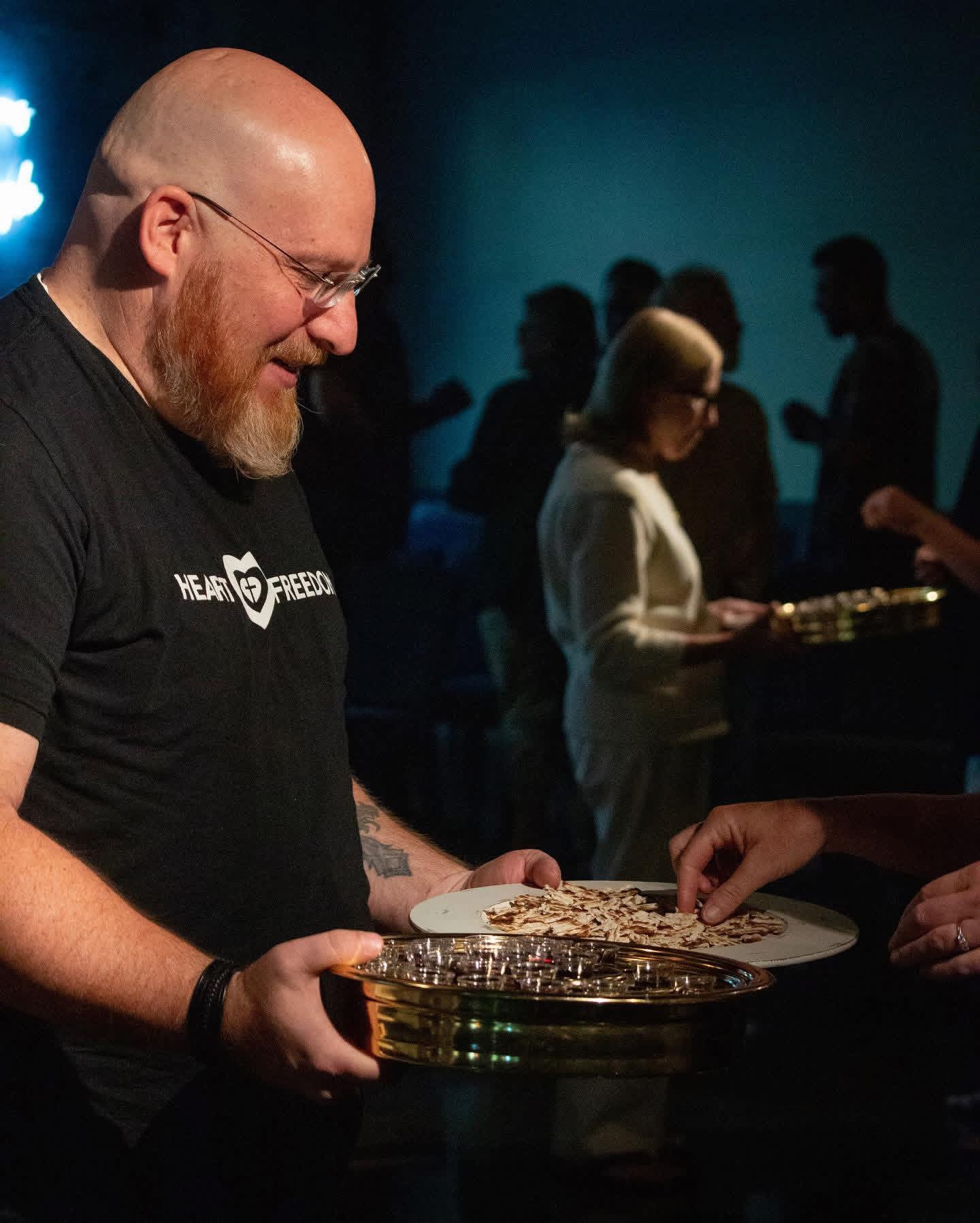 Guests taking communion together at a Heart Freedom Encounter gathering